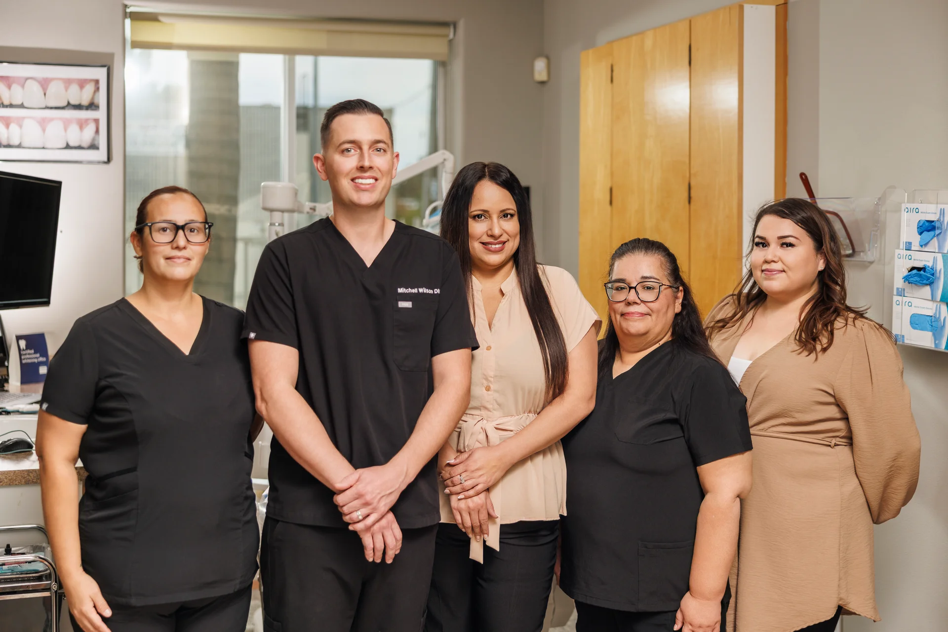The Paradise Dental Group team together in the office