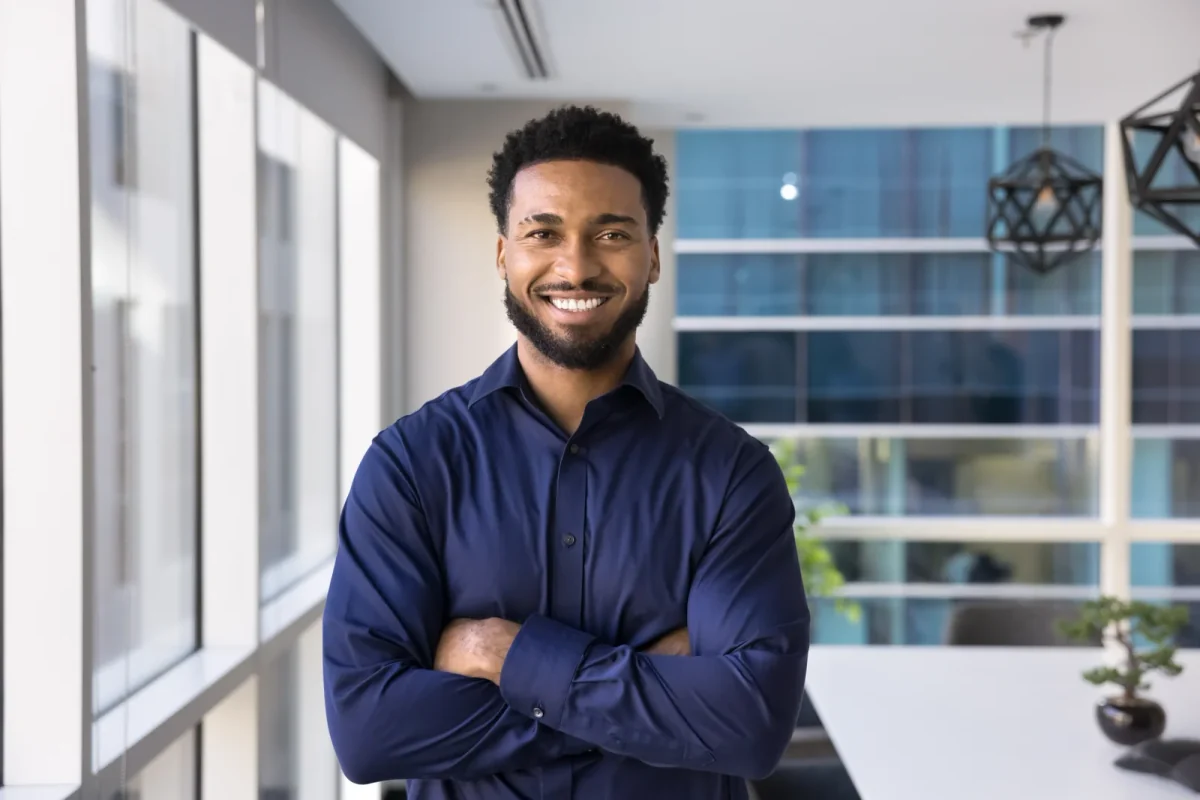 Smiling man wearing a navy shirt